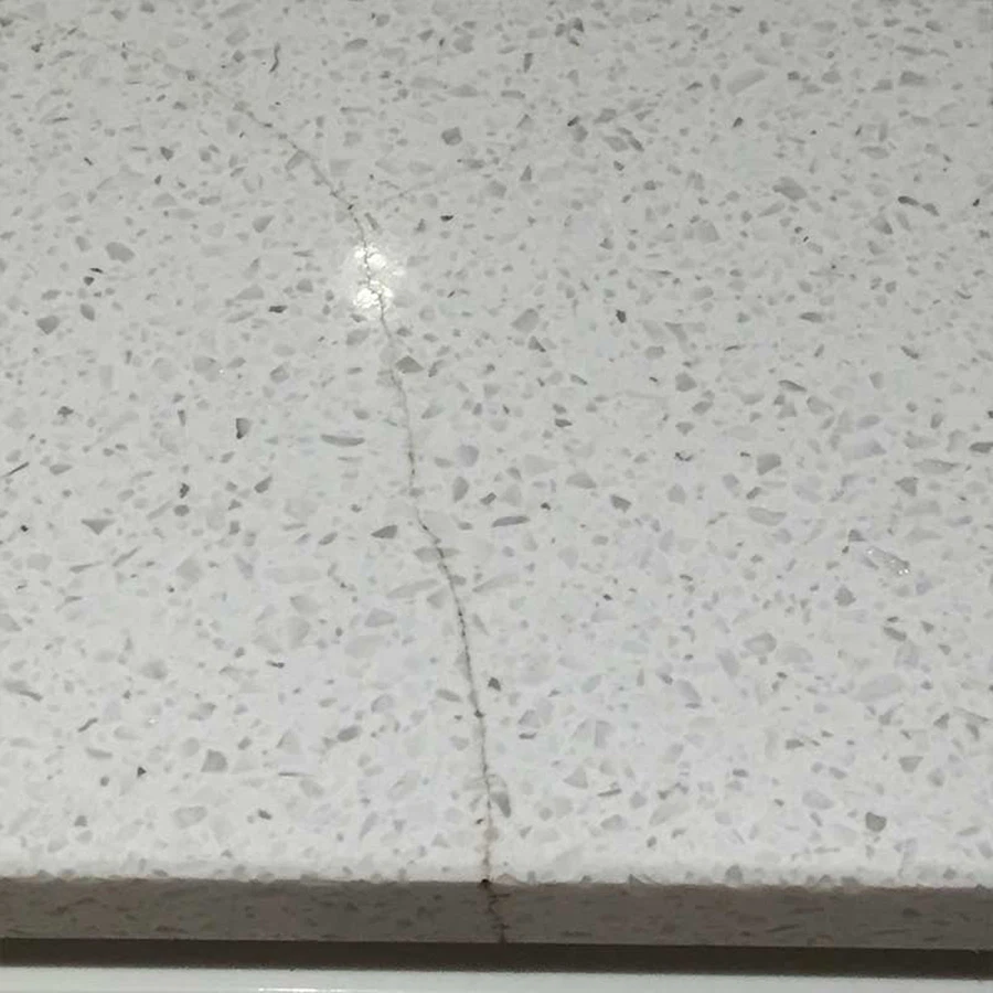 Crack on White Linen Quartz Before Repair